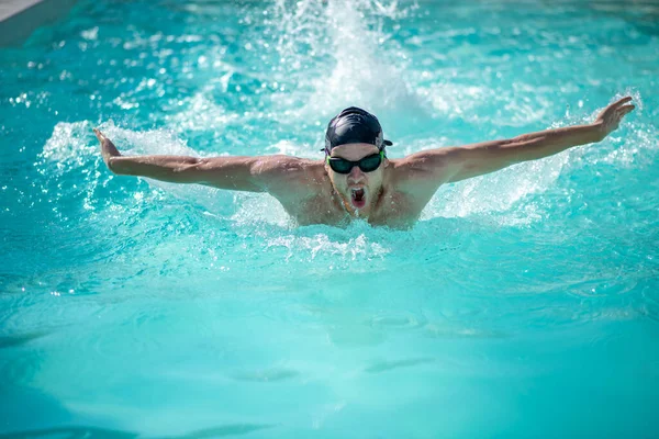 Swimmer on chest, hands to sides, mouth is open — Stock Photo, Image