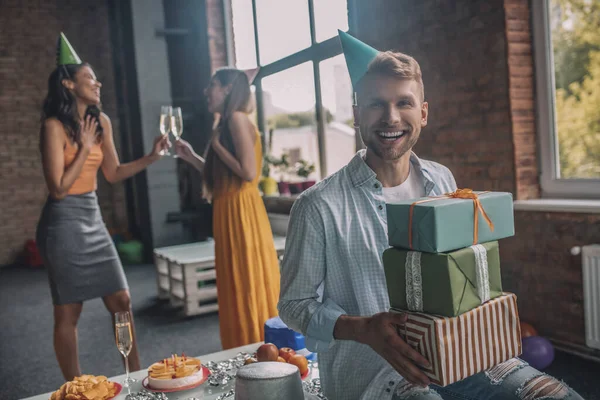 Birthday boy receiving gifts at his birthday party