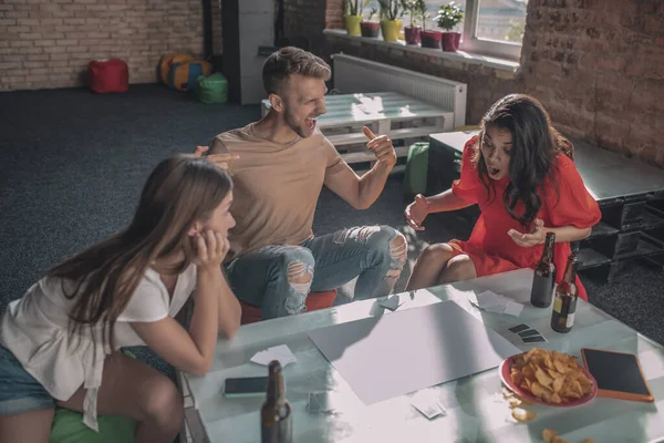 Emotional people playing an interesting board game