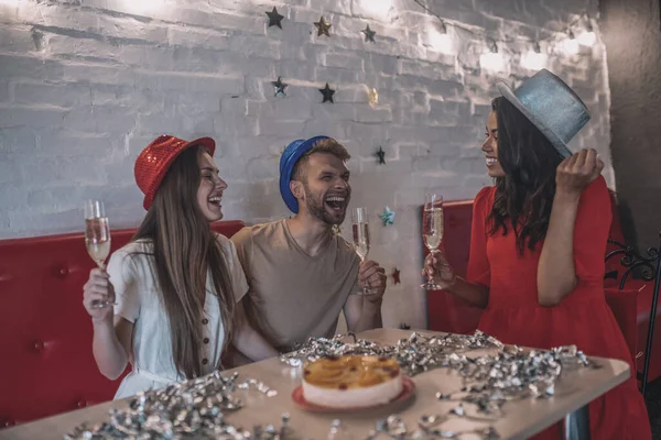 Three friends having a party in the bar