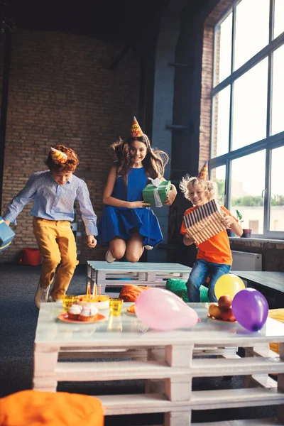 Three friends in bday hats having fun together — Stock Photo, Image