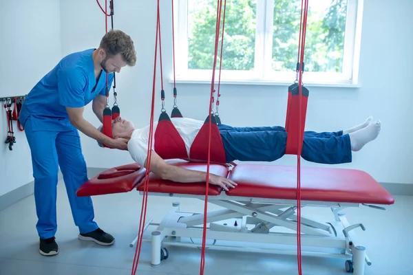 stock image Male doctor and patient fixed over couch