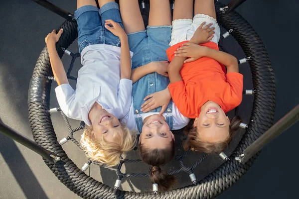 Kids relaxing after play and looking happy — Stock Photo, Image