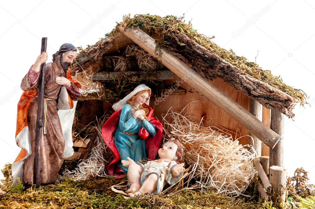 Christmas nativity scene. Hut with baby Jesus in the manger, with Mary and Joseph. Isolated on white background.