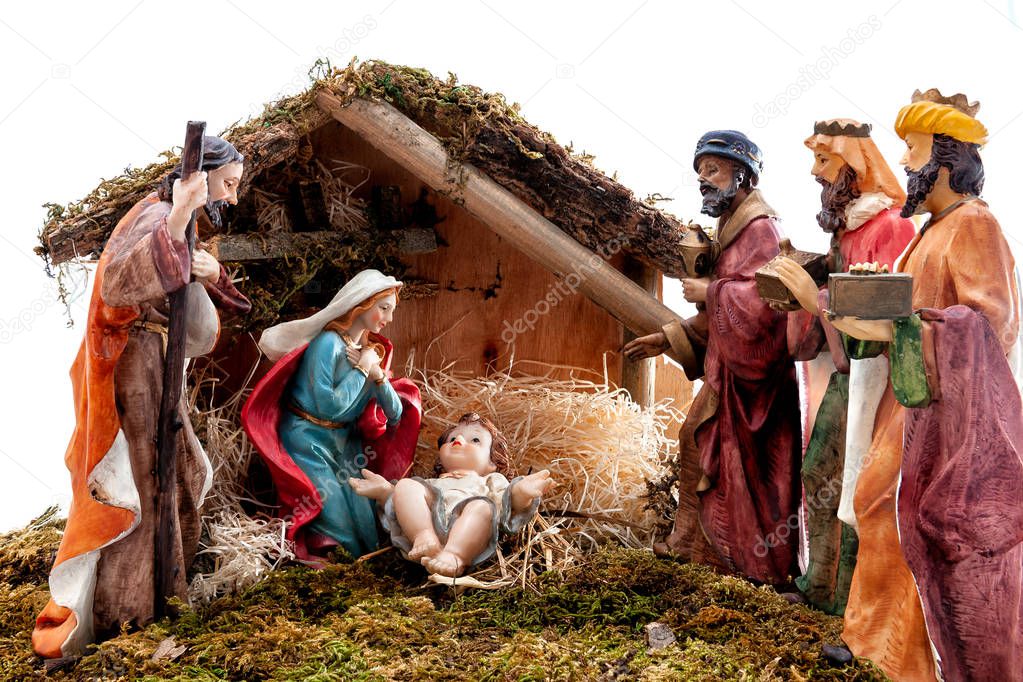 Christmas nativity scene. Hut with baby Jesus in the manger, with Mary, Joseph and the three wise men. Isolated on white background.