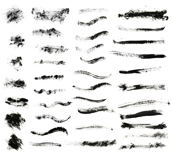 set of black paint brush strokes isolated on white background