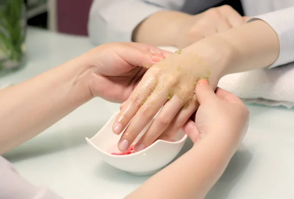 master does a manicure in the salon. SPA peeling