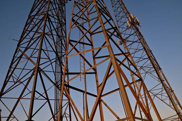 Three Radio Cell Phone Telecommunication Towers Provide Triangular Geometric Shapes — Stock Photo, Image