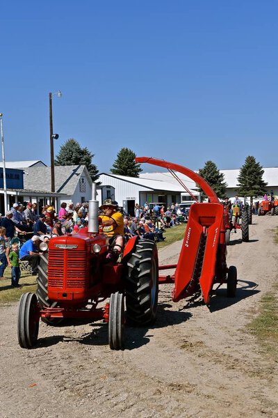 PEKIN, NORTH DAKOTA, September 2, 2018:  The old McCormick Deering   tractor and single row silage chopper are being displayed at the parade during the  Labor Day Stump Lake Village Threshing Bee.