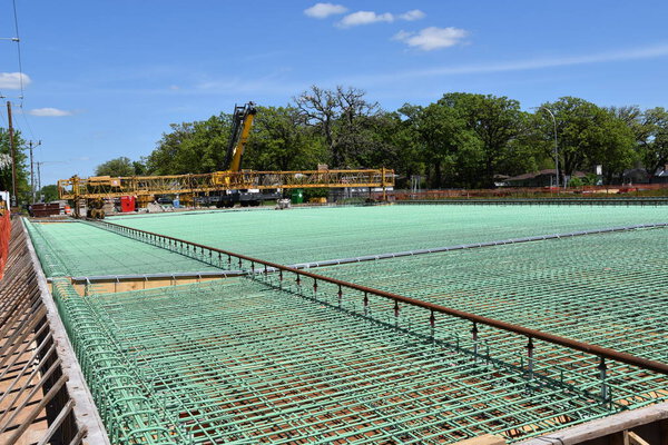 Layers of rebar in the construction of a bridge over a four lane highway which is ready for concrete