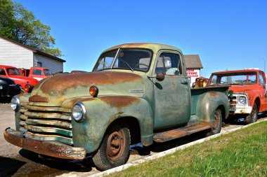LAKE PARK, MINNESOTA, May 31, 2019: The old 40`s/early 50`s pickup colloquially referred to as Chevy and formally the Chevrolet Division of General Motors Company, is an American automobile division of the American manufacturer clipart