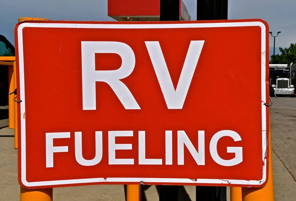 A sign at a gasoline station displays a sign for RV FUELING