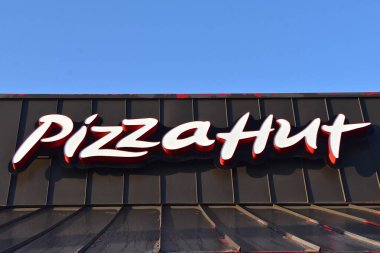 BISMARCK, NORTH DAKOTA, August 1, 2020:  The logo and sign represents Pizza Hut, an American restaurant chain and founded in 1958 in Wichita, Kansas by the Carney.s clipart