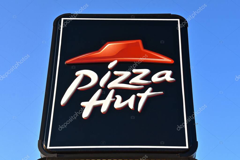 BISMARCK, NORTH DAKOTA, August 1, 2020:  The logo and sign represents Pizza Hut, an American restaurant chain and founded in 1958 in Wichita, Kansas by the Carney.s