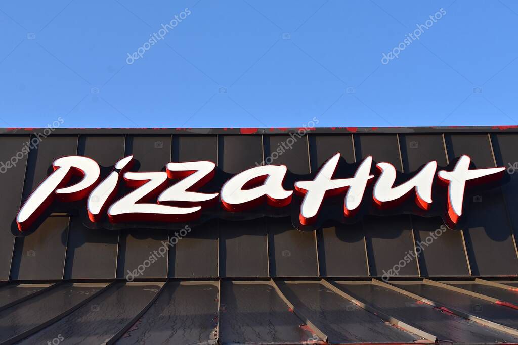 BISMARCK, NORTH DAKOTA, August 1, 2020:  The logo and sign represents Pizza Hut, an American restaurant chain and founded in 1958 in Wichita, Kansas by the Carney.s