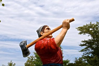 ABERDEEN, SOUTH DAKOTA, August 7, 2020: Paul Bunyan and Babe are displayed at the Land Of Oz(Storybook Land) sponsored by The Sertoma Club and the Aberdeen Parks, Recreation and Forestry Department. clipart