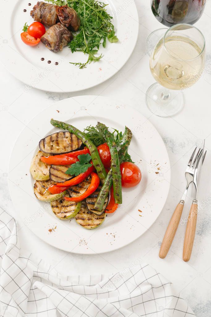 Top view of grilled vegetables on white plate