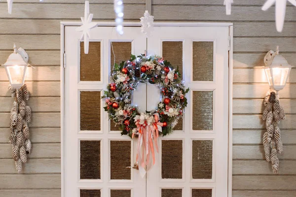close up view of festive christmas wreath on door