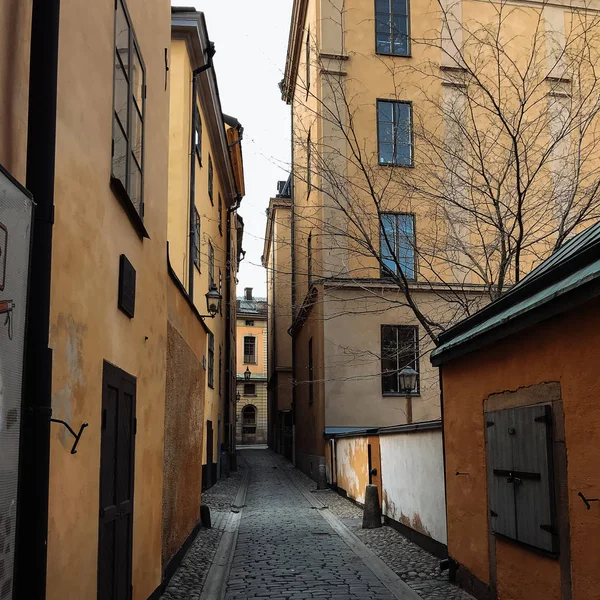 Narrow street with houses in daylight, Stockholm, Sweden
