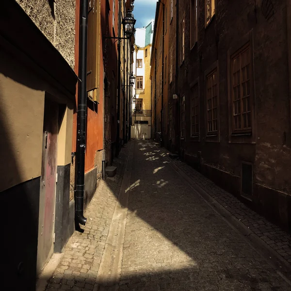 Narrow street with houses in daylight, Stockholm, Sweden