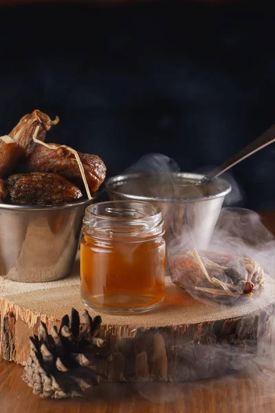 delicious honey in jar and dry figs