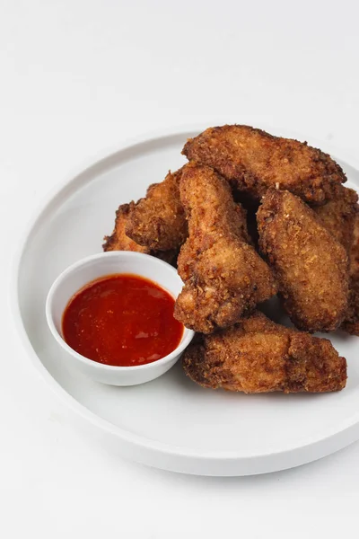 fried chicken pieces with tomato ketchup
