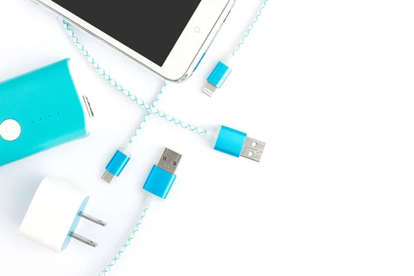 USB charging cables with smartphone and battery bank in top view