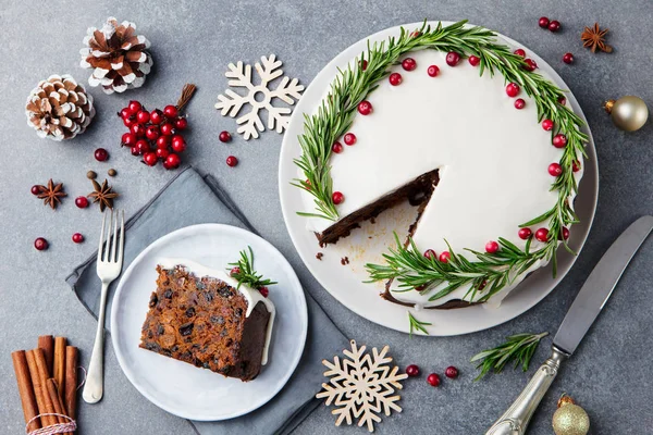 Christmas fruit cake, pudding on white plate. Copy space. Top view.