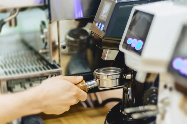 barista makes coffee in cafe closup view