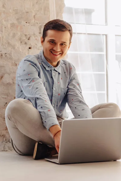 Young Stylish Guy Floor Working Laptop Light Sunny Interior Freelancer — Stock Photo, Image