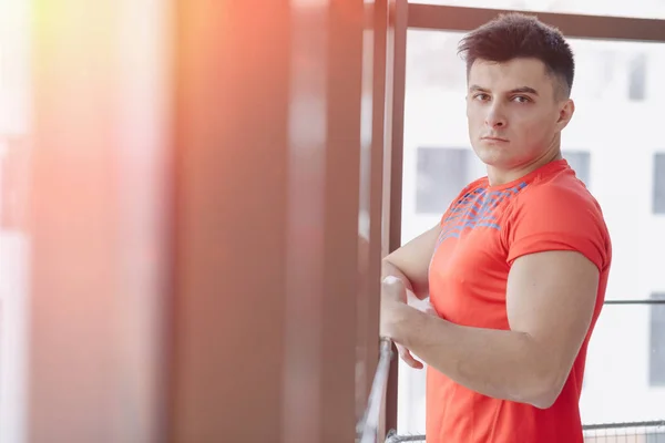 Joven en la ventana — Foto de Stock