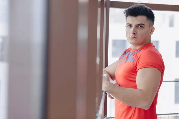 Joven en la ventana — Foto de Stock