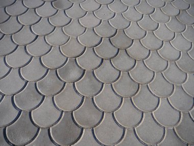 Eğri ölçekli geometri çapraz yuvarlak zemin taş doku arka plan Döşe.