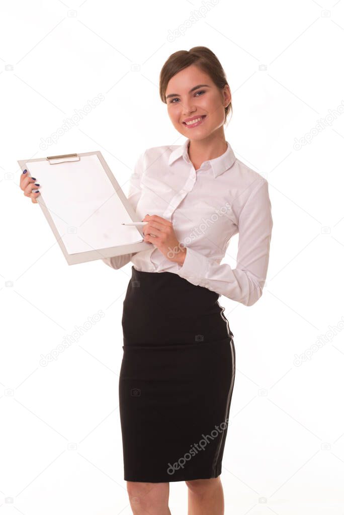 Office worker posing at camera with tablet for notes. Brunette girl shows with a pen on the empty space for the inscription and logo.