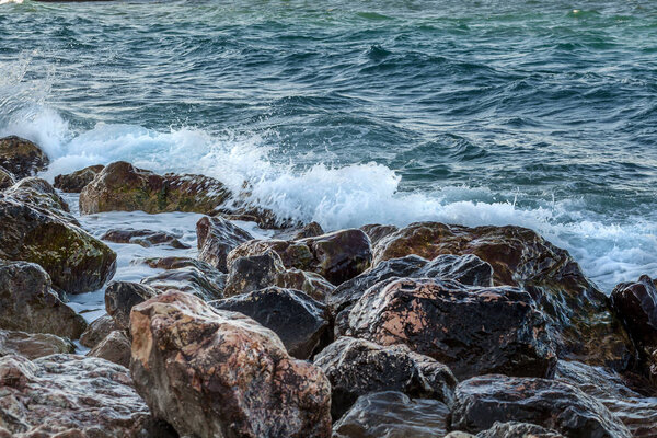 Close-up of sea waves crashing on the rocks