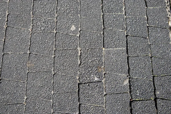 Närbild av en trottoar klinkergolv i Poznan — Stockfoto