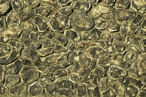 Fragment of wall with unfinished granite. Wall Cladding Southwark Cathedral — Stock Photo, Image