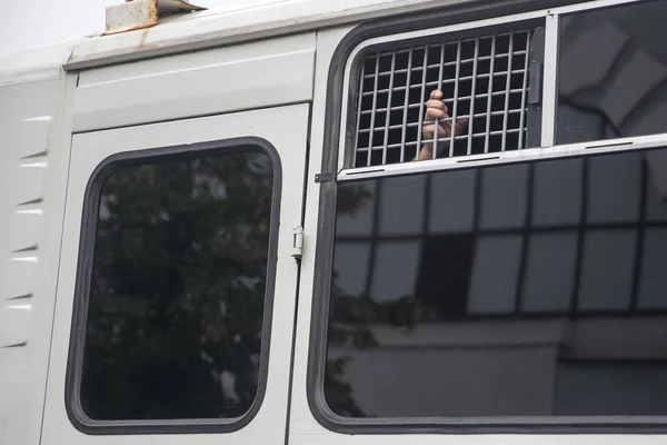 Protest held in Moscow over arrest of investigative journalist Ivan Golunov. man looks through bars of a police avtozak - Car for transportation of suspects and accused — Stock Photo, Image