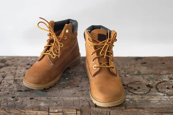 Yellow Tourist Winter Boots Old Wooden Bench White Background Studio — Stock Photo, Image