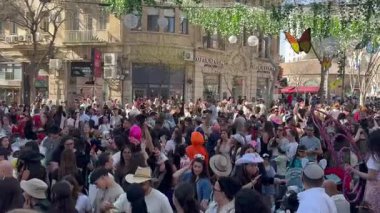 Jerusalem, Israel, September 2025, Purim in the city. A crowd of young people  girls and boys  dance at a large disco in the city center.