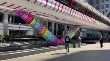 London, UK, 12 September 2025, Canary Wharf  Beneath the Colorful Adams Place Footbridge in London Docklands