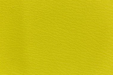 Kanepenin yüzeyinde yapay deri bir arka plan var.