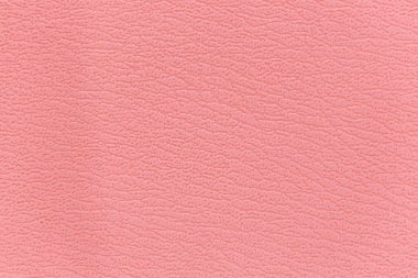 Kanepenin yüzeyinde yapay deri bir arka plan var.