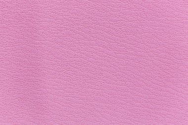 Kanepenin yüzeyinde yapay deri bir arka plan var.