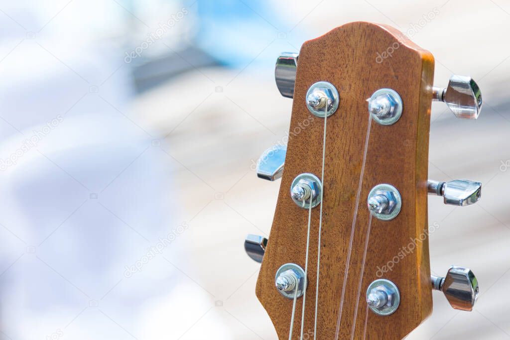 detail of guitar with shallow musical background