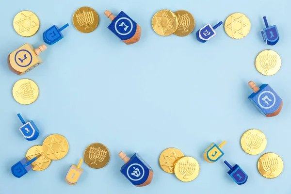 Blue Background Multicolor Dreidels Chocolate Coins Hanukkah Judaic Holiday Concept — Stock Photo, Image