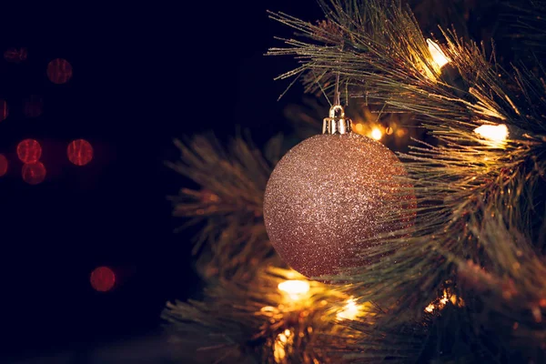 Seasonal background with Christmas toy on the tree. Celebration concept. Soft focus. Horizontal