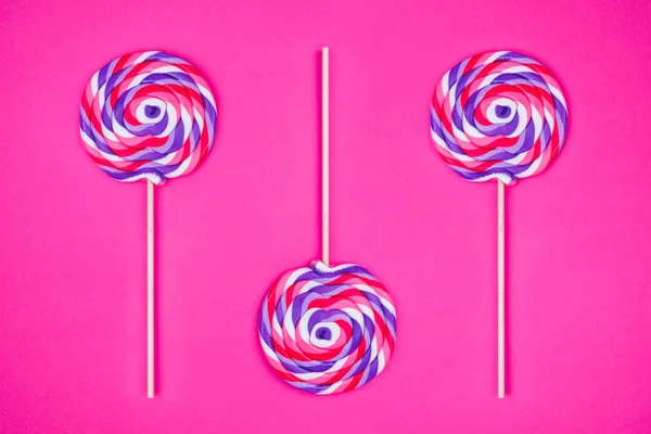Big Lollipops Solid Pink Background Horizontal — Stock Photo, Image