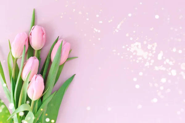 Pink tulips on the pink background with festive lights bokeh. Valentines, spring  and Mother day background. — Stock Photo, Image