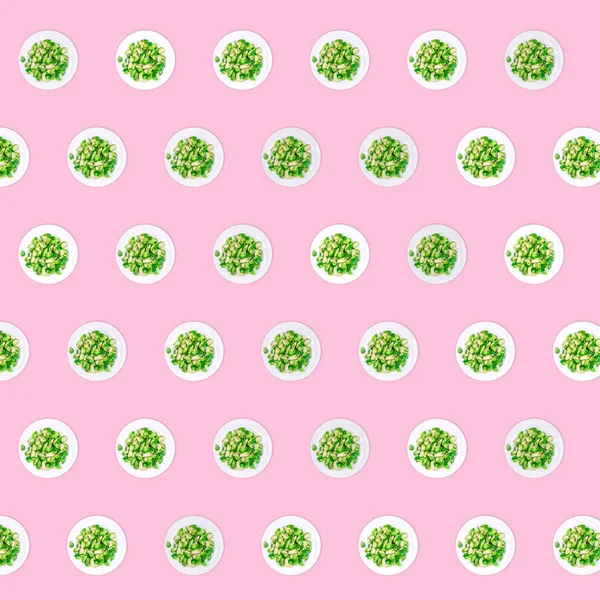 Pattern of plates with lightly fried brussels sprouts on the neon pink drop — Stock Photo, Image